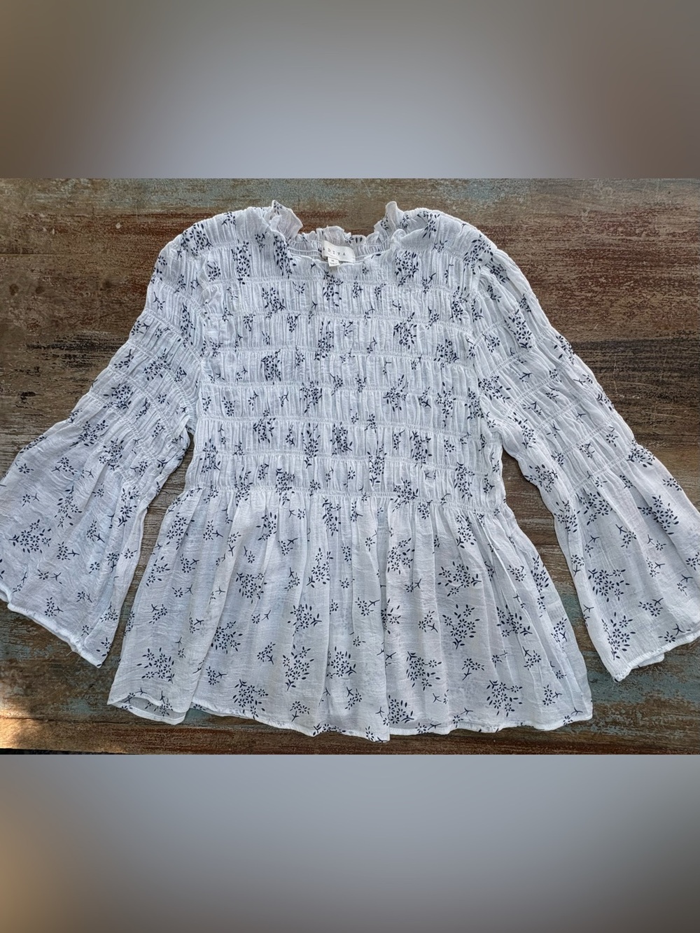 Adiva White Smocked Peplum Blouse with Navy Floral Print